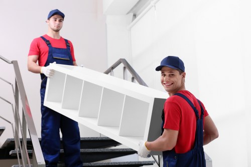 Professional movers packing household items in Chiswick